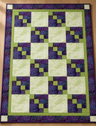 Carmon's Quilt Shop Dragonfly Wonder City Lights 3-yard quilt in purple and green geometric cotton fabric