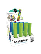 Carmon's Quilt Shop Dritz Bobbin Boat display box filled with green and blue plastic bobbin storage holders