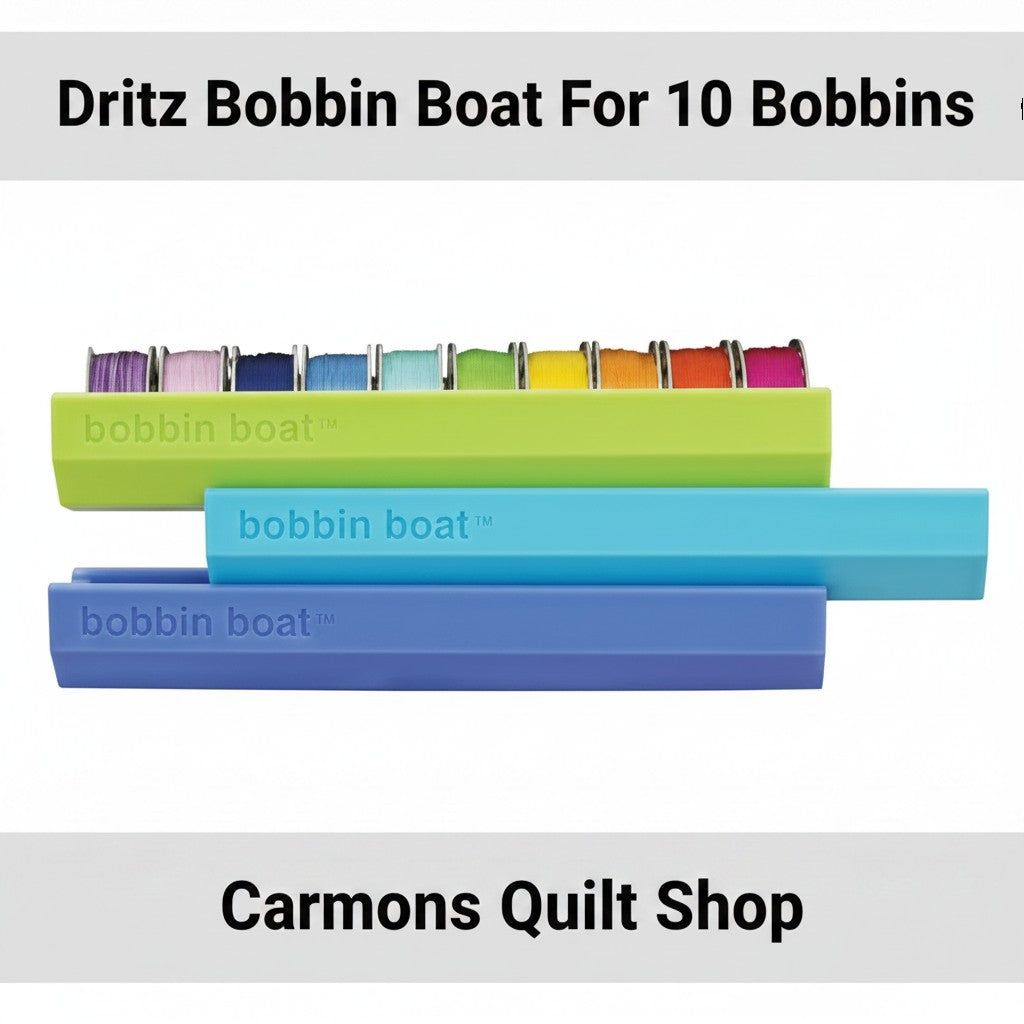 Carmon's Quilt Shop Dritz Bobbin Boat organizers in green, blue, and purple for storing sewing machine bobbins.