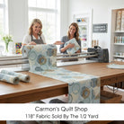 Carmon's Quilt Shop dusty aqua cotton fabric with overlapping circle geometric print on a longarm quilting machine