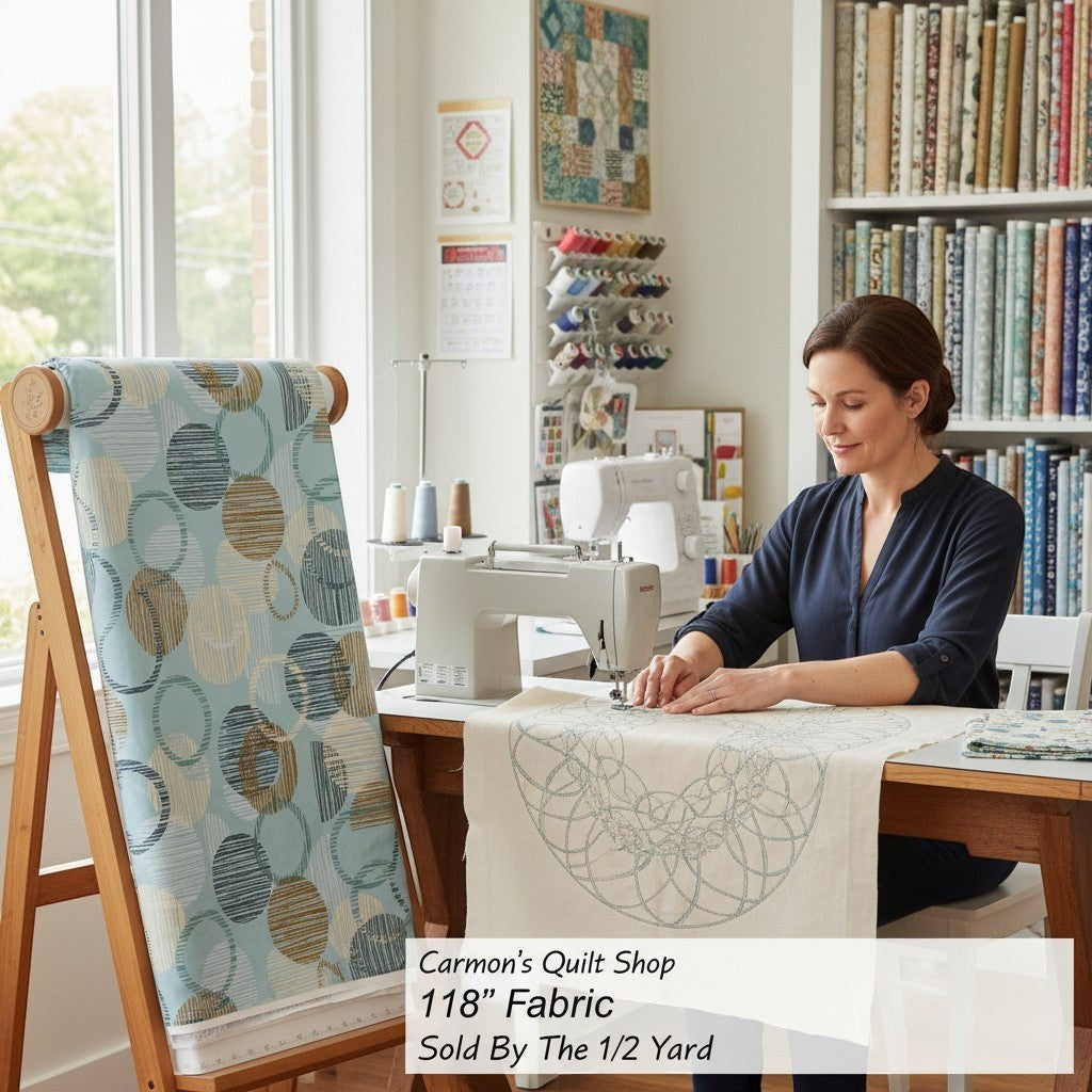 Carmon's Quilt Shop 118 inch dusty aqua cotton fabric with overlapping circle geometric print on a quilting frame