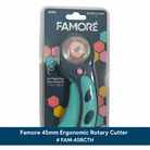 Carmon's Quilt Shop Famore 45mm ergonomic rotary cutter in teal and pink packaging for quilting and fabric cutting.
