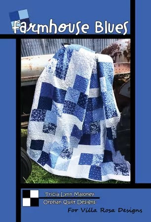Carmon's Quilt Shop Farmhouse Blues quilt pattern featuring a blue and white patchwork square design on a throw quilt.