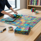 Carmon's Quilt Shop Fiesta Phantasma 108-inch wide cotton fabric with colorful hexagon and starburst pattern on a table