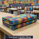 Carmon's Quilt Shop Fiesta Phantasma 108-inch wide cotton quilt backing with a colorful geometric hexagon starburst print.