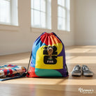Carmon's Quilt Shop FIFA World Cup 26 drawstring backpack kit with colorful geometric pattern and trophy logo.