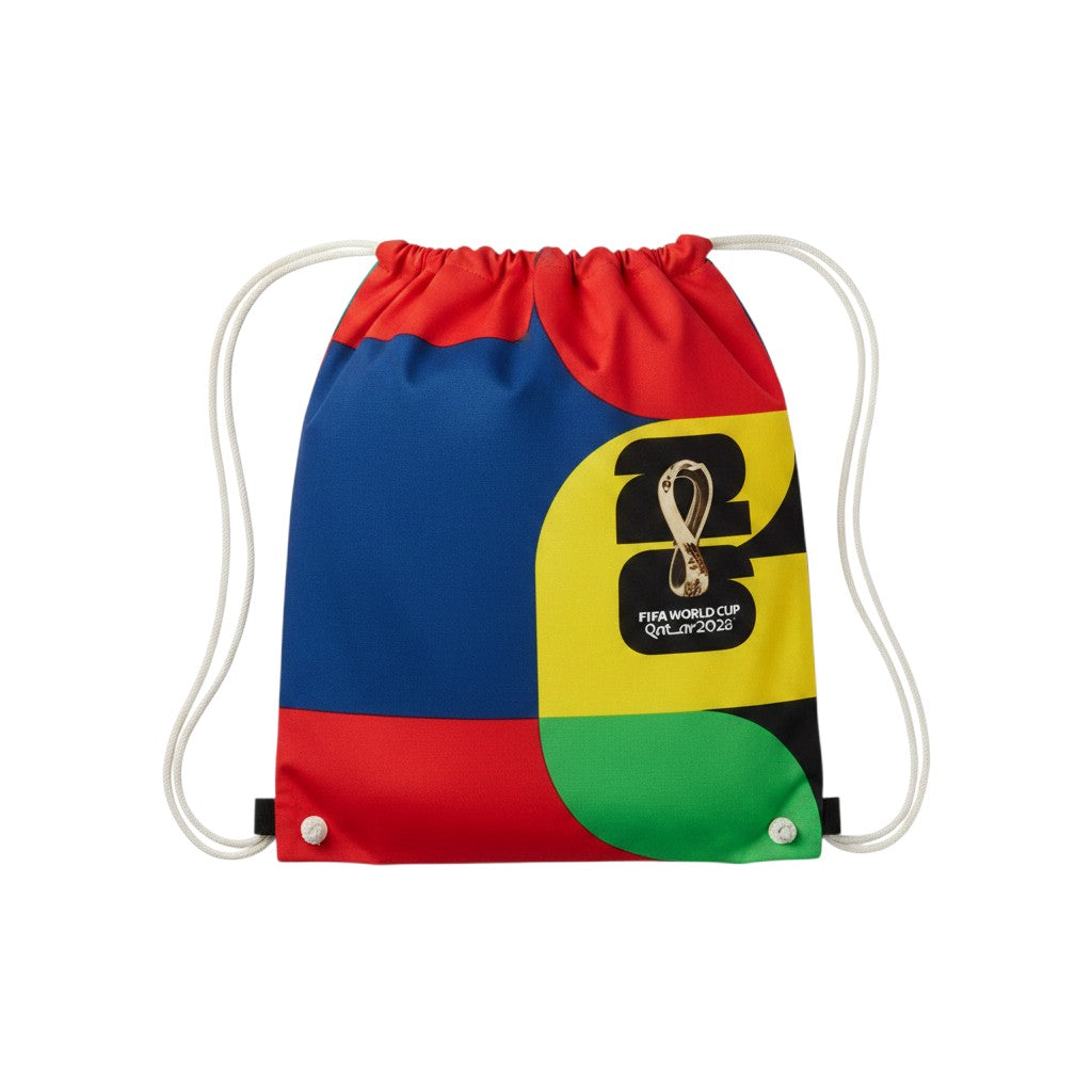 Carmon's Quilt Shop FIFA World Cup 26 drawstring backpack kit with bold red, blue, yellow, and green color blocks and official logo.