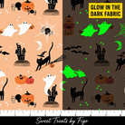 Carmon's Quilt Shop FIGO Fabrics Sweet Treat orange cotton featuring Halloween castles, ghosts, and cats with glow effect