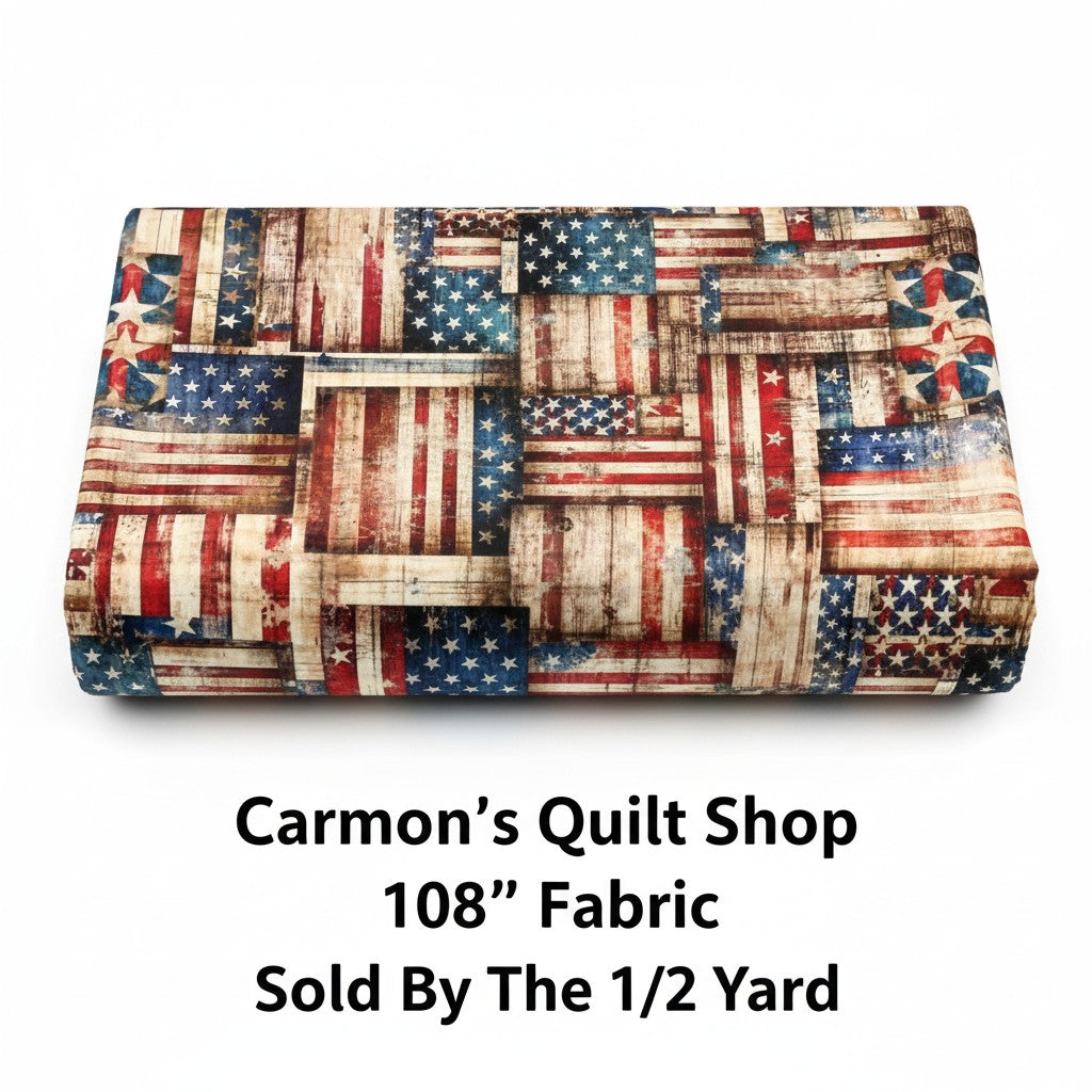 Carmon's Quilt Shop 108 inch wide cotton fabric featuring a rustic red, white, and blue American flag patchwork print.