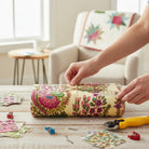 Carmon's Quilt Shop Outstretched Cream Backing 108" fabric with vibrant floral botanical print in fuchsia, pink, green, and rust on pale yellow.