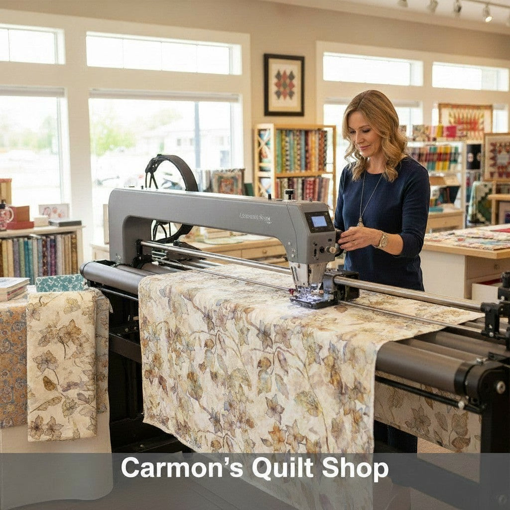 Carmon's Quilt Shop professional using a longarm machine to quilt QT Fabrics Panorama tonal floral cotton backing