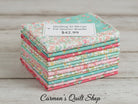 Carmon's Quilt Shop Quilting in Bloom fat quarter bundle featuring 13 floral cotton fabric prints in pink and teal.