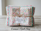 Carmon's Quilt Shop Quilting in Bloom fat quarter bundle of 13 floral cotton fabrics tied with twine