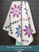 Carmon's Quilt Shop For the Love of Precuts quilt pattern book featuring a floral quilt with purple and blue petals