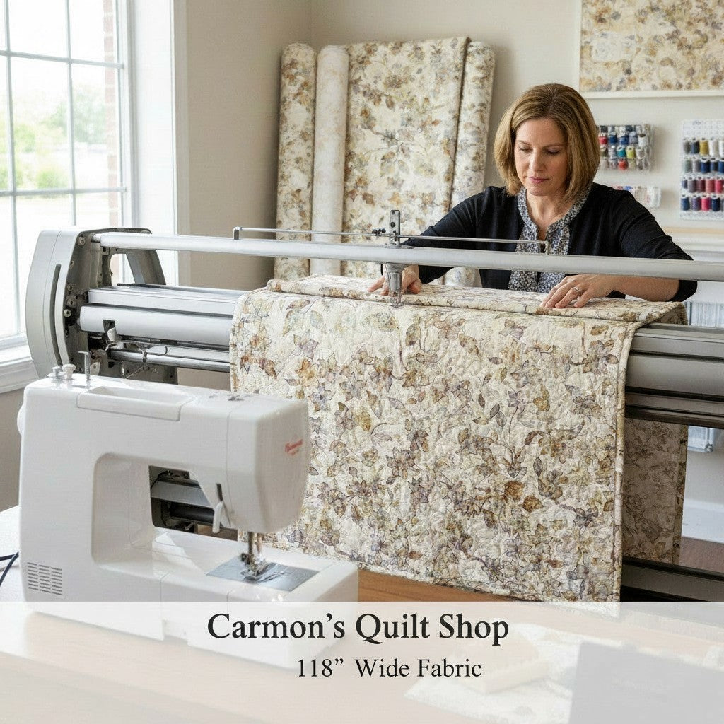 Carmon's Quilt Shop woman using a longarm quilting machine with QT Fabrics Panorama tonal floral 118 inch cotton fabric