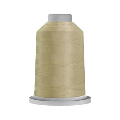Carmon's Quilt Shop Glide 40wt trilobal polyester thread on a 5,500-yard king spool in a light tan neutral color.