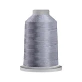 Carmon's Quilt Shop Glide 40wt trilobal polyester thread on a 5,500-yard king spool in a shimmering grey shade.