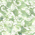 Carmon's Quilt Shop Island Batik Vintner's Treasure fabric in green with white floral patterns for quilting.