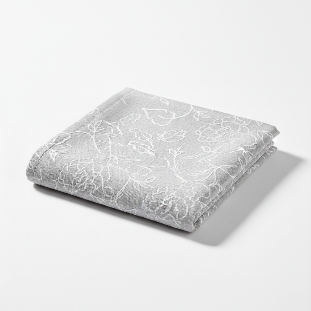 Carmon's Quilt Shop grey 100% cotton quilting fabric with a delicate white floral line art pattern.