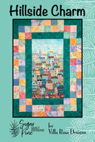 Carmon's Quilt Shop Hillside Charm quilt pattern featuring a colorful cityscape center and patchwork border.