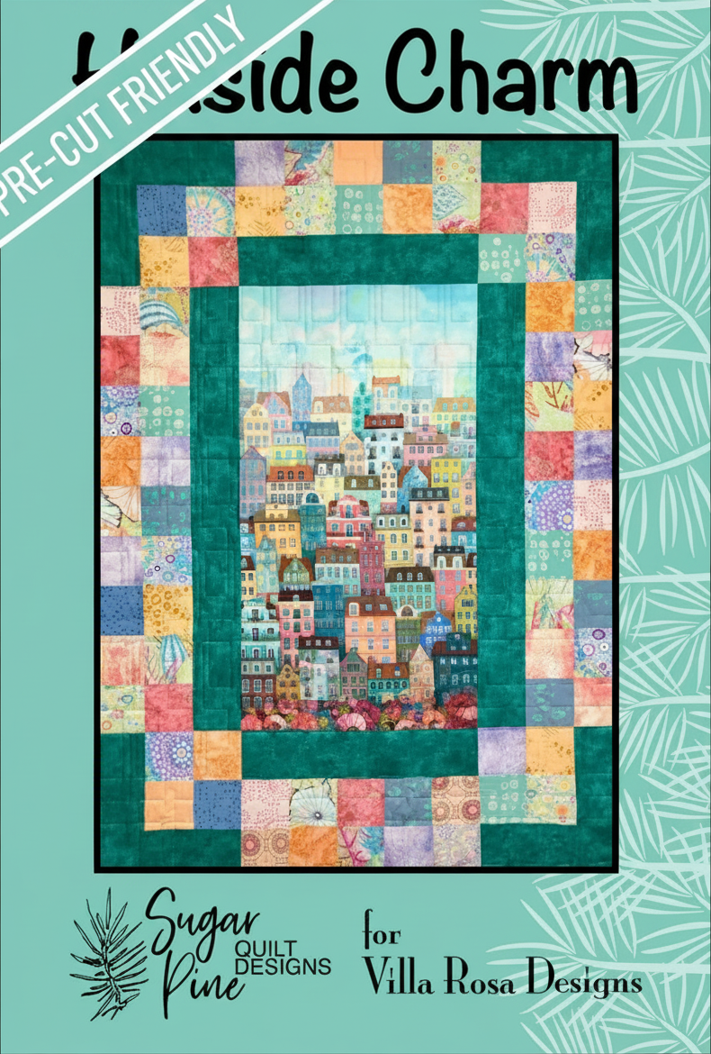 Carmon's Quilt Shop Hillside Charm quilt pattern featuring a colorful cityscape center and patchwork border