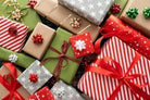 Carmon's Quilt Shop advent box collection featuring festive wrapped gifts with red, green, and silver holiday patterns