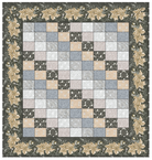 Carmon's Quilt Shop Holiday Flourish quilt featuring a patchwork center and a festive floral border.