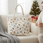 Carmon's Quilt Shop tote bag made from Snowbound white cotton fabric featuring festive holiday ornament patterns.