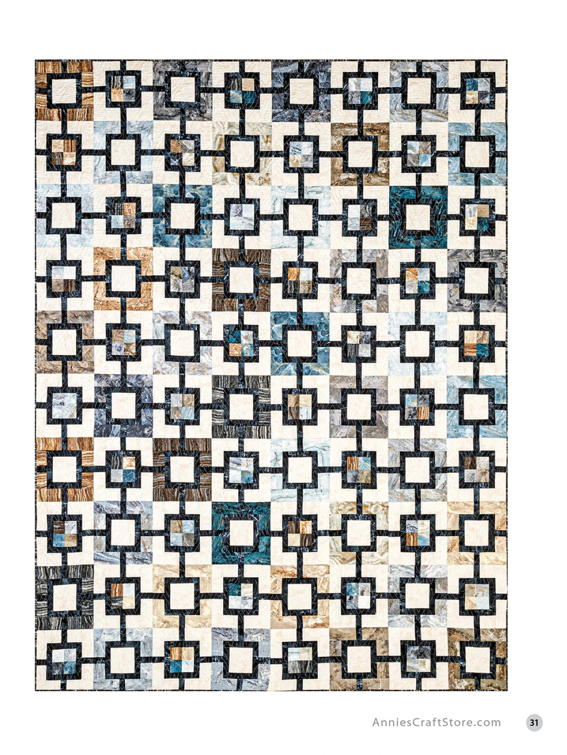 Carmon's Quilt Shop quilt pattern featuring a geometric grid design with blue, brown, and cream fabric squares.