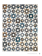 Carmon's Quilt Shop quilt pattern featuring a geometric grid design with blue, brown, and cream fabric squares.