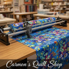 Carmon's Quilt Shop Jewel of the Sea cotton fabric with colorful tropical fish and coral reef print on a quilting machine
