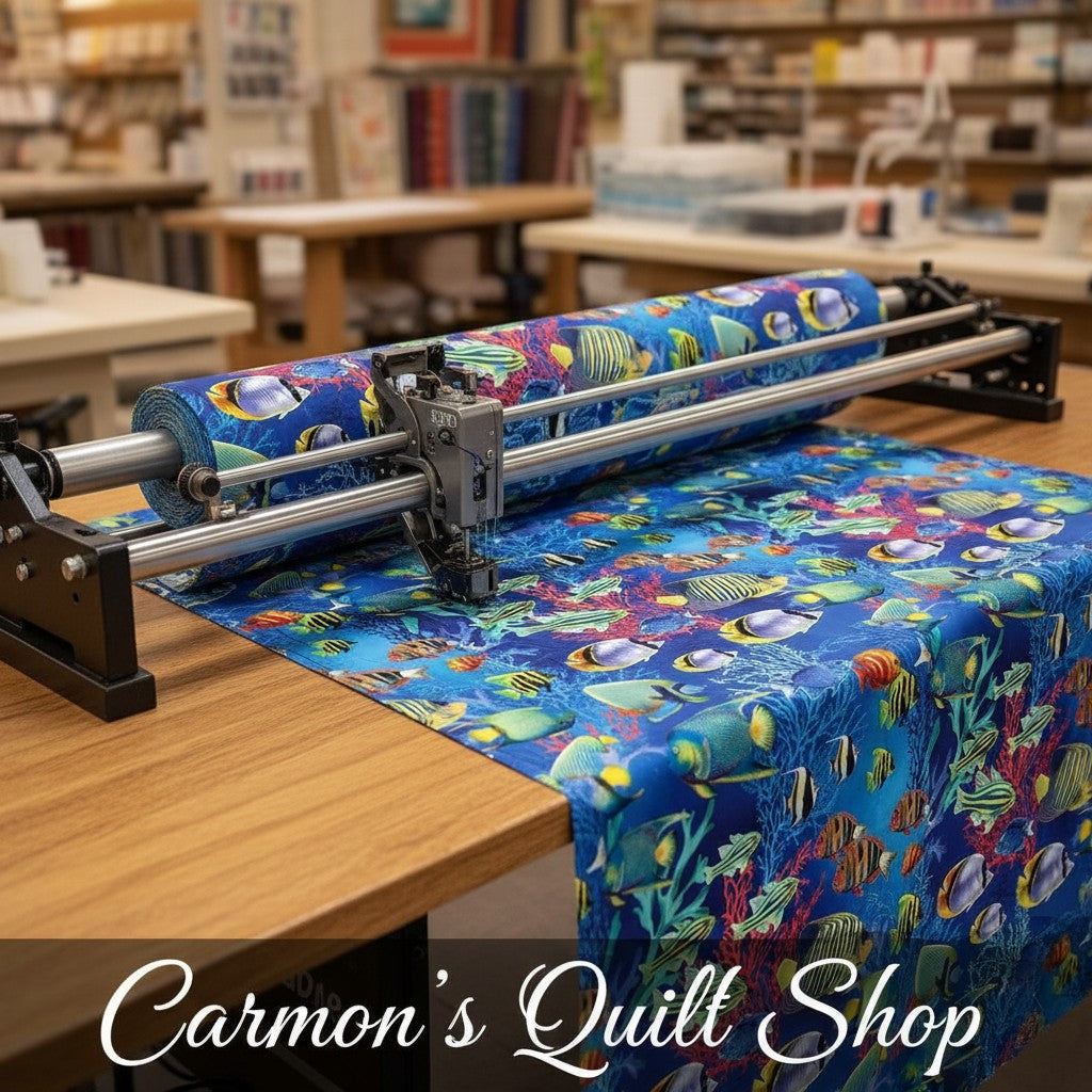 Carmon's Quilt Shop Jewel of The Sea cotton fabric featuring colorful tropical fish and coral on a blue background