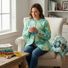 Carmon's Quilt Shop Jungle Wide Fabric, 100% cotton, 108" wide, featuring a vibrant floral pattern in fiesta colors with geometric accents.