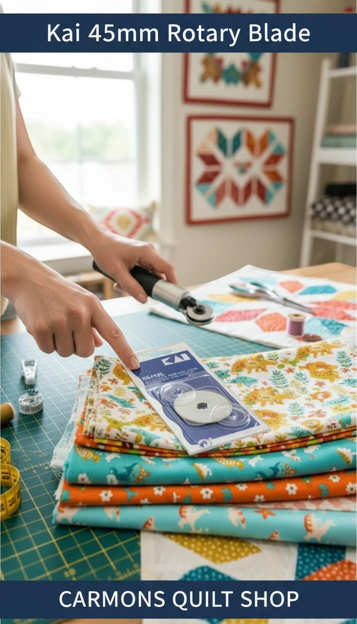 Carmon's Quilt Shop Kai 45mm metal rotary blade in packaging on a cutting mat with fabric for quilting projects