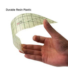 Carmon's Quilt Shop Kearing hot ironing ruler being bent to show the flexible, heat-resistant resin plastic material.