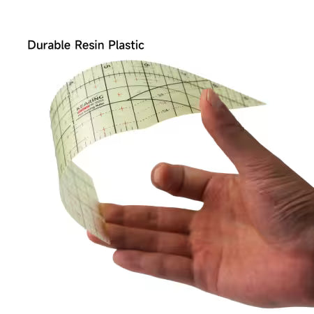 Carmon's Quilt Shop Kearing hot ironing ruler being bent to show the flexible, heat-resistant resin plastic material.