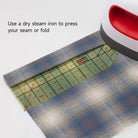 Carmon's Quilt Shop Kearing hot ironing ruler with 30-degree angle guide pressing a fabric hem with a heat press
