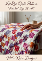 Carmon's Quilt Shop LaRue quilt pattern by Villa Rosa Designs featuring a disappearing nine-patch design on a bed.