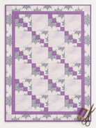 Carmon's Quilt Shop Dragonfly Wonder City Lights lavender quilt kit featuring floral prints and geometric blocks.
