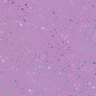 Carmon's Quilt Shop Dragonfly Wonder lavender fabric with a colorful speckled paint splatter pattern