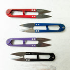 Carmon's Quilt Shop LDH Thread Snips XL in red, blue, purple, and black for precision sewing and quilting.