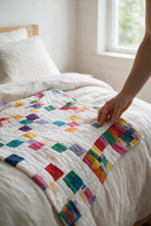 Carmon's Quilt Shop Lollipop Villa Rose quilt pattern featuring colorful mini charm squares on a white background.