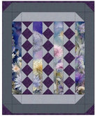 Carmon's Quilt Shop Lovely Flowers quilt pattern featuring floral panels with purple and lavender diamond accents.