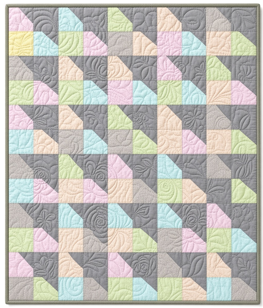 Carmon's Quilt Shop Main Street quilt kit featuring colorful geometric patchwork with floral quilting patterns.