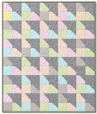 Carmon's Quilt Shop Main Street quilt kit featuring colorful geometric patchwork with floral quilting patterns.