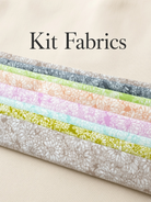 Carmon's Quilt Shop Main Street quilt kit fabrics featuring floral prints in soft pastel and neutral tones.