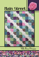 Carmon's Quilt Shop Main Street quilt pattern featuring a geometric four-patch design with heart-like shapes