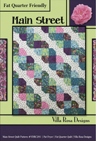 Carmon's Quilt Shop Main Street quilt pattern featuring a geometric four-patch design with heart-like shapes.