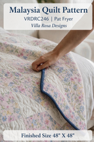 Carmon's Quilt Shop Malaysia quilt pattern by Villa Rosa Designs featuring floral patchwork squares and blue binding