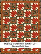 Carmon's Quilt Shop 5-yard quilt featuring a red maple leaf pattern with floral blocks and a rust-colored border.